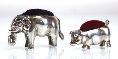 Lot 392 - Two novelty metalware pin cushions modelled as...