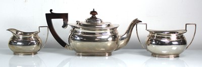Lot 399 - A silver three piece tea service of typical...