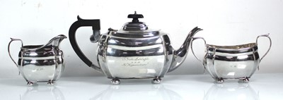 Lot 402 - A silver three piece tea service of typical...