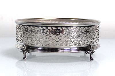 Lot 405 - A pierced silver coaster with frosted glass...