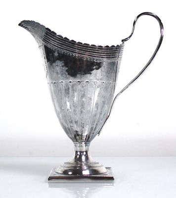 Lot 409 - A George III silver cream jug of helmet form,...