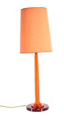 Lot 445 - A 1960's orange perspex table lamp with a...