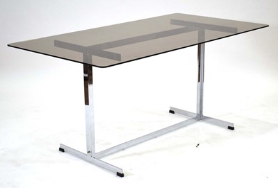 Lot 459 - A 1970's dining table, the smoked glass...