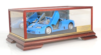Lot 159 - A cased model of a Bugatti with plaque...