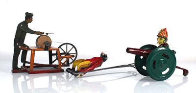 Lot 164 - Three penny type toys comprising a scissor...