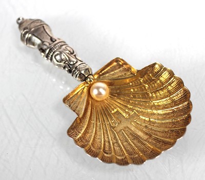 Lot 430 - A metalware parcel gilt caddy spoon of shell...