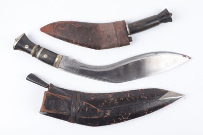 Lot 1084 - Two Kukri knives: 12 ins and 7½ ins blades,...