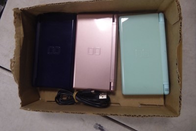 Lot 2124 - 3 Nintendo DS's with cable