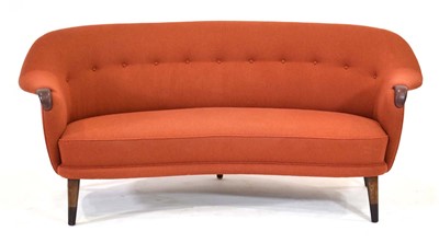 Lot 472 - A 1960's Danish 'banana' sofa with pale red...