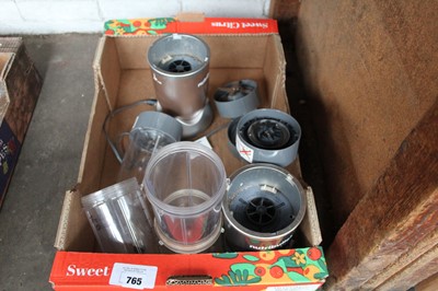 Lot 765 - 2 Nutri Bullet machines with various jugs
