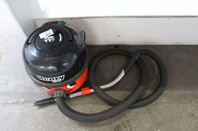 Lot 817 - Henry tug along vacuum cleaner with hose and...