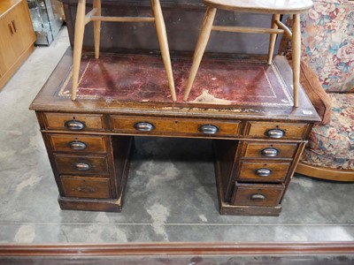 Lot 1114 - Dark oak twin pedestal office desk with an...