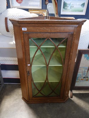 Lot 1136 - Dark oak glazed single door hanging corner...