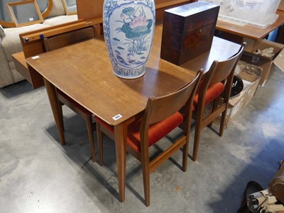 Lot 1169 - Mid-century teak extending dining table and 4...