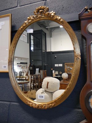 Lot 1220 - Oval wall mirror in decorative gilt frame