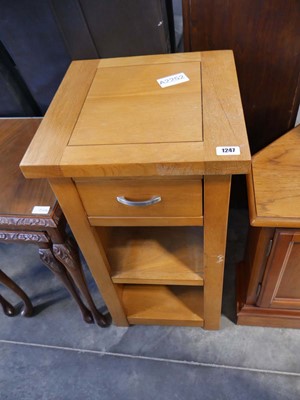 Lot 1247 - Light oak single drawer stand