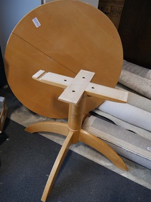 Lot 1253 - Beech effect circular extending single...