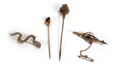 Lot 669 - A 9ct yellow gold brooch of serpent form set...