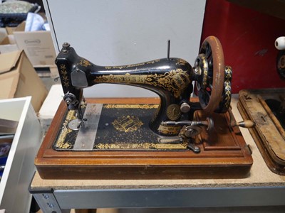 Lot 1290 - Cased manual operated Singer sewing machine