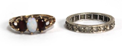 Lot 676 - A 9ct white gold eternity ring set paste, ring...