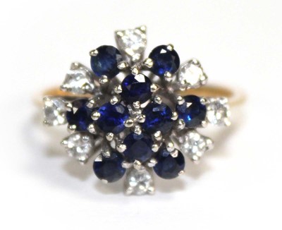 Lot 680 - An 18ct yellow gold cluster ring set ten small...