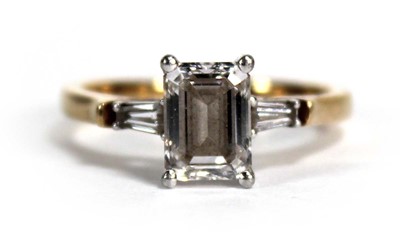 Lot 681 - An 18ct yellow gold ring set emerald cut lab...