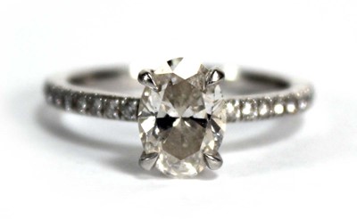 Lot 682 - A platinum ring set an oval brilliant cut...