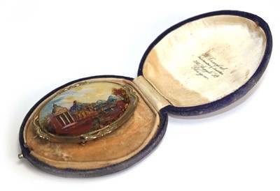 Lot 700 - A gilt metal mounted mother of pearl brooch of...