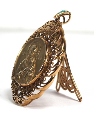 Lot 708 - A yellow metal openwork pendant of imposing...