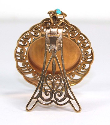 Lot 708 - A yellow metal openwork pendant of imposing...