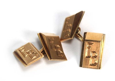 Lot 710 - A pair of yellow metal cufflinks of wedge...