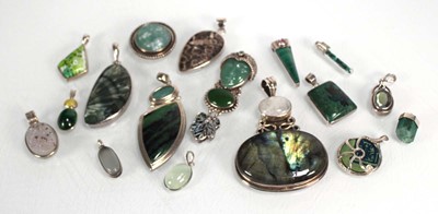Lot 726 - Seventeen silver and metalware pendants, each...