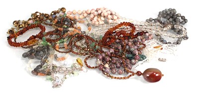 Lot 732 - A group of pale pink hardstone, glass and...