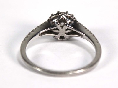 Lot 737 - A platinum cluster ring set seven brilliant...