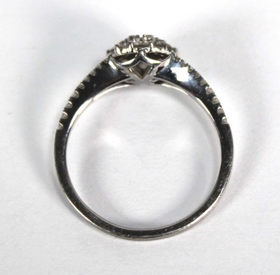 Lot 737 - A platinum cluster ring set seven brilliant...