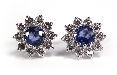 Lot 741 - A pair of white metal ear studs, each set a...