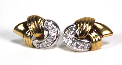 Lot 745 - A pair of yellow and white metal highlighted...