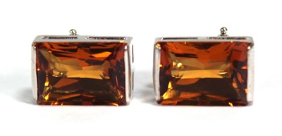 Lot 746 - A pair of 18ct white gold ear studs, each set...