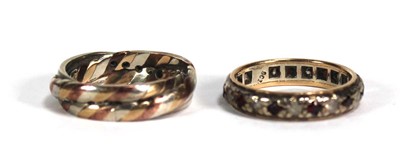 Lot 754 - A 9ct tri-colour gold multi band ring set...