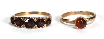 Lot 755 - A 9ct yellow gold ring set five graduated...