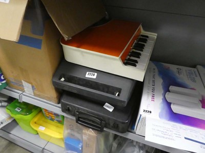 Lot 2228 - Two typewriters and a toy piano