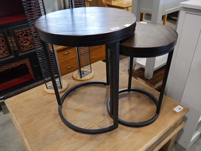 Lot 1332 - Nesting pair of circular dark wood coffee...