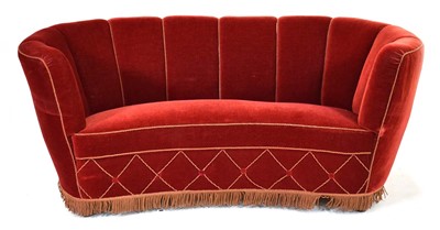 Lot 517 - A 1950/60's Danish 'Banana' sofa with red...