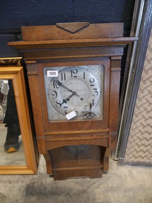 Lot 1372 - Dark oak cased wall clock of Art Deco design