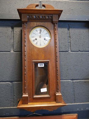 Lot 1373 - Dark oak case wall clock, the face bearing...