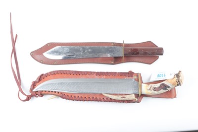 Lot 1106 - Two bowie knives: 10½ ins blade with wood...