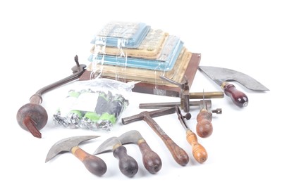 Lot 1108 - Box of assorted leather working tools inc. 56...