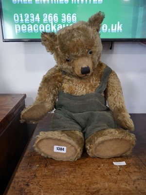 Lot 1384 - Vintage teddy bear in green corduroy dungrees