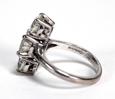 Lot 800 - An 18ct white gold ring set three graduated...
