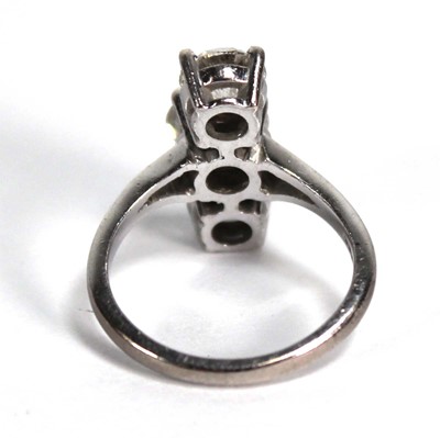 Lot 800 - An 18ct white gold ring set three graduated...